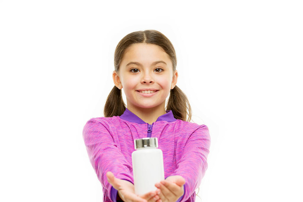 small girl share pills. small child isolated on white. pills for healthy growth. food additives complex. healthy sporty kid vitamin jar. happy childhood. Most important vitamins. Who cares about diet - Fotografie, Obrázek