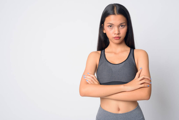Portrait of young beautiful Asian woman with arms crossed ready for gym - Φωτογραφία, εικόνα