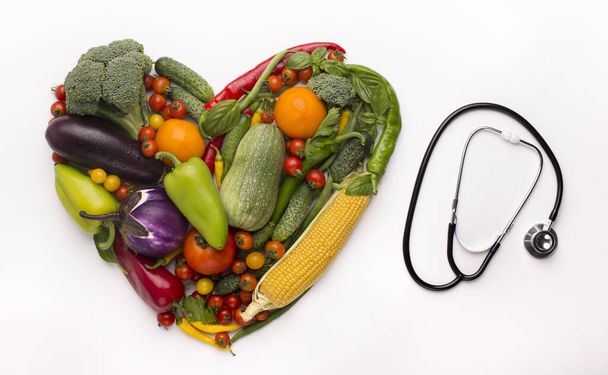 Heart of vegetables and stethoscope isolated on white - Foto, Imagem