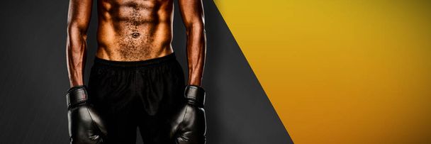 Muscular boxer against black metal texture - Фото, зображення