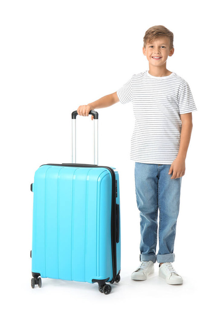 Cute little boy with suitcase on white background - Фото, изображение