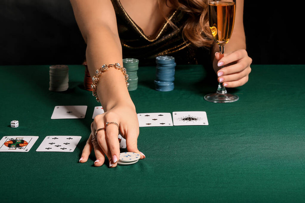 Female player at table in casino, closeup - Foto, Bild