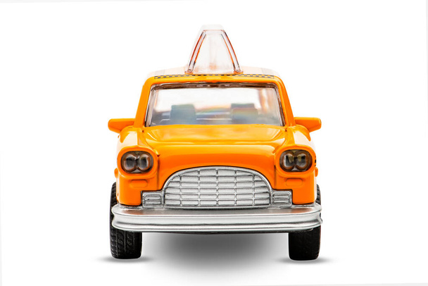 Yellow taxi toy retro car model on a white background. Isolated - Photo, image