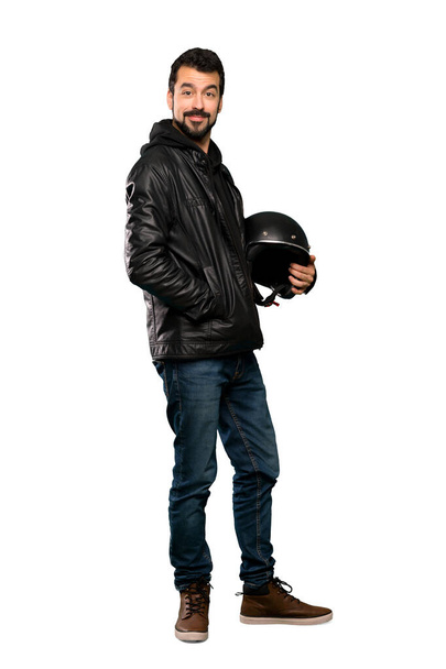 Full-length shot of Biker man laughing over isolated white background - Foto, immagini