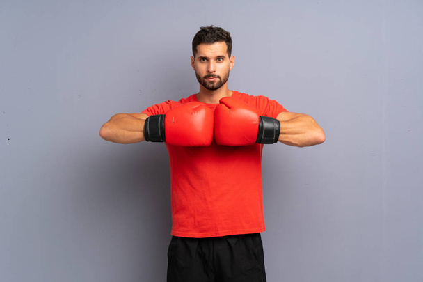 Young sport man with boxing gloves - Photo, image