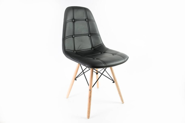 Black leather chair isolated on a white background - great for article about home decor essentials - Fotó, kép