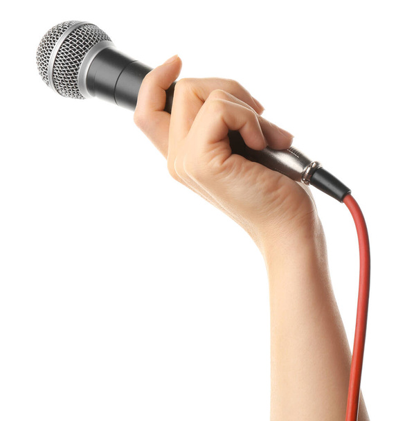 Female hand with microphone on white background - Zdjęcie, obraz