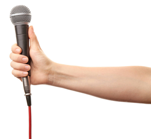 Main féminine avec microphone sur fond blanc
 - Photo, image