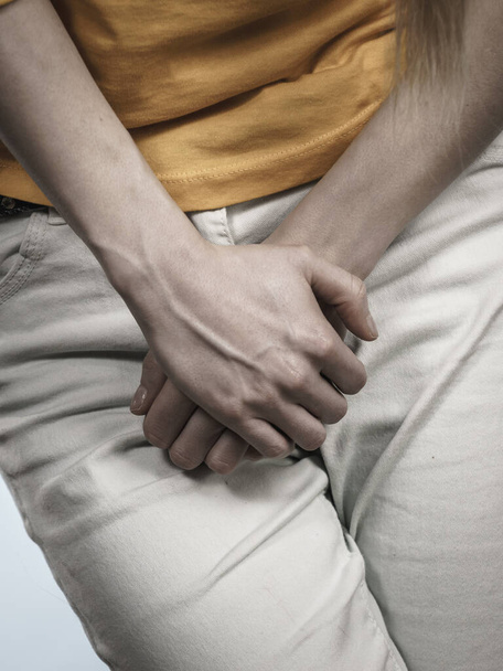 Woman with hands holding her crotch - Фото, зображення