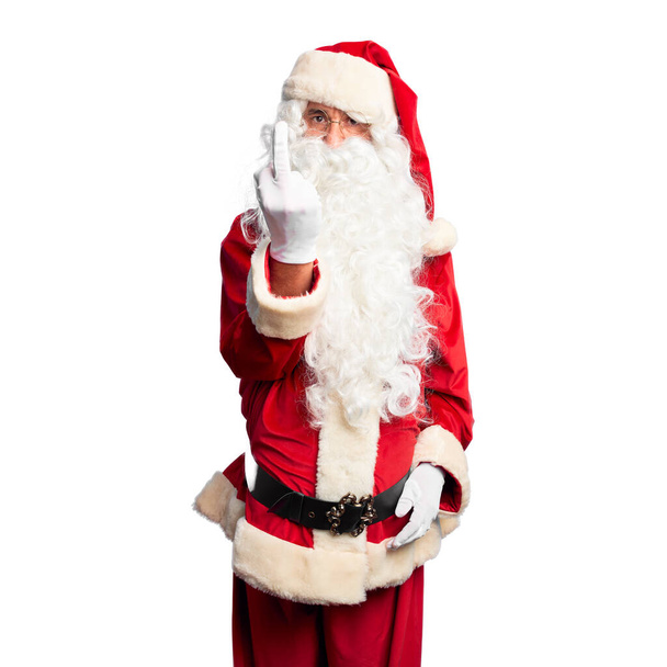 Keski-ikäinen komea mies yllään Joulupukin puku ja parta seisoo Näyttää keskisormi, epäkohtelias ja töykeä vittu pois ilme
 - Valokuva, kuva