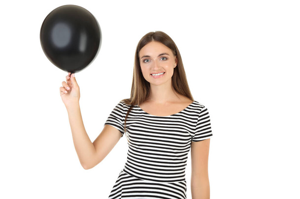 Young woman with black balloon on white background - Фото, изображение