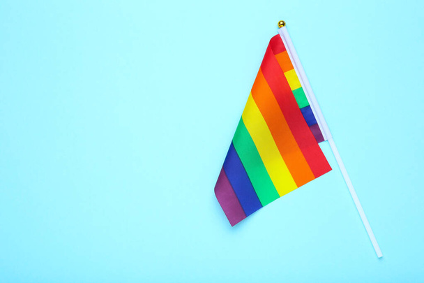 Rainbow flag on blue background - Фото, изображение