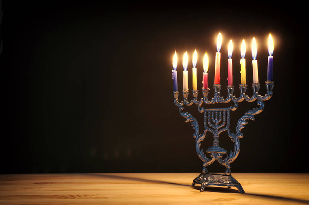 Religion image of jewish holiday Hanukkah background with menorah (traditional candelabra) and candles - Foto, imagen