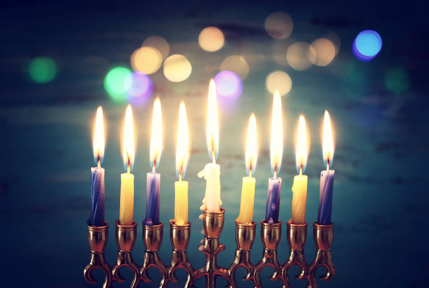 Religion image of jewish holiday Hanukkah background with menorah (traditional candelabra) and candles - Foto, Imagen
