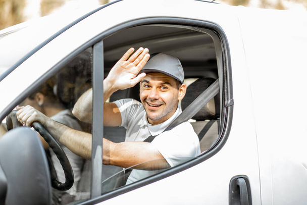 Portrait of delivery driver in the car - Fotoğraf, Görsel