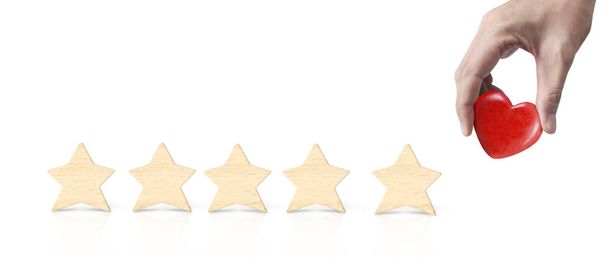 Mão de colocar aumento de madeira forma de cinco estrelas
 - Foto, Imagem