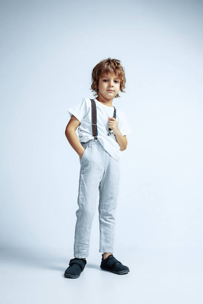 Pretty young boy in casual clothes on white studio background - Zdjęcie, obraz