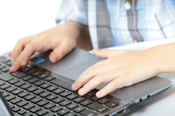 boy's hand typing on laptop keyboard - Foto, imagen