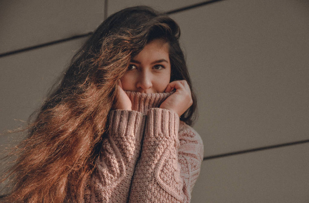 young woman with long hair in sweater  autumn park brunettewinter cold  - 写真・画像