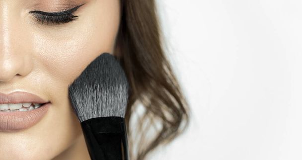 Young Cute Woman Using Makeup Brush - Foto, Imagem
