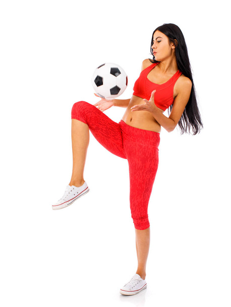 Fitness woman in a red sports suit with soccer balls  - Fotoğraf, Görsel