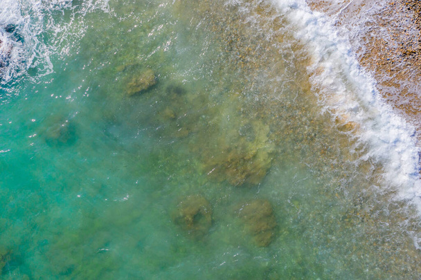 Aerial view of seashore in windy daytime - Foto, afbeelding