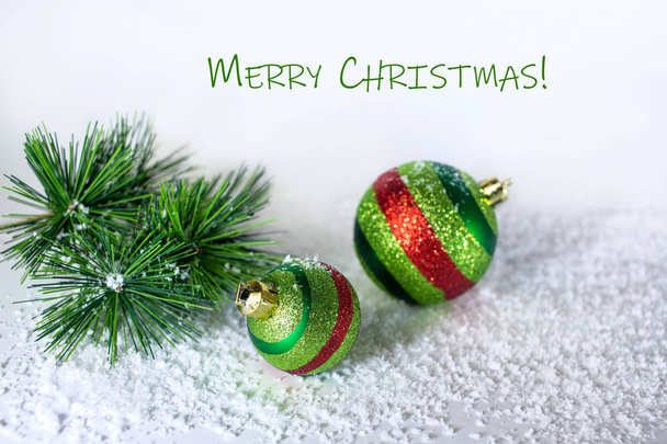Spruce branch, Christmas balls shiny, green in the snow. Christmas decorations - Fotografie, Obrázek