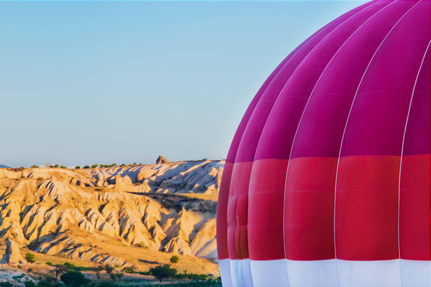 Close up shot of hot air balloon during flight in Cappadocia valleys. - Fotó, kép