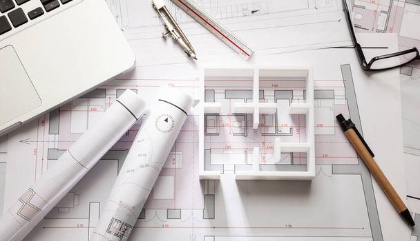 Construction concept. Residential building drawings and house model, - 写真・画像