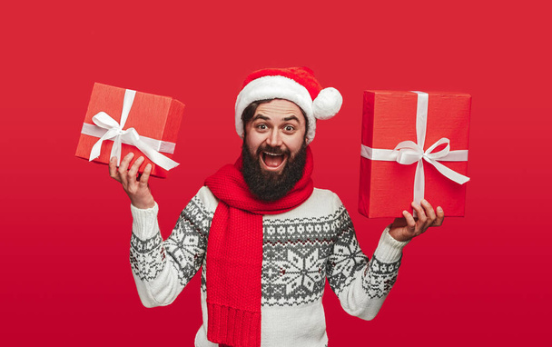 Excited hipster showing Christmas presents - Foto, Imagem