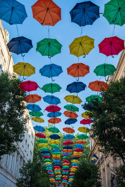 Suspended umbrellas, part of a charity fundraiser for ADHD aware - 写真・画像