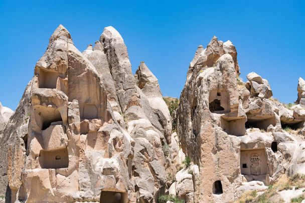 Ancient volcanic stones with caves and holes, Cappadocia, Turkey. - Foto, Bild