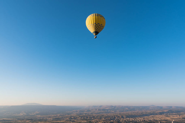 Close up shot of hot air balloon during flight in Cappadocia valleys. - Фото, зображення