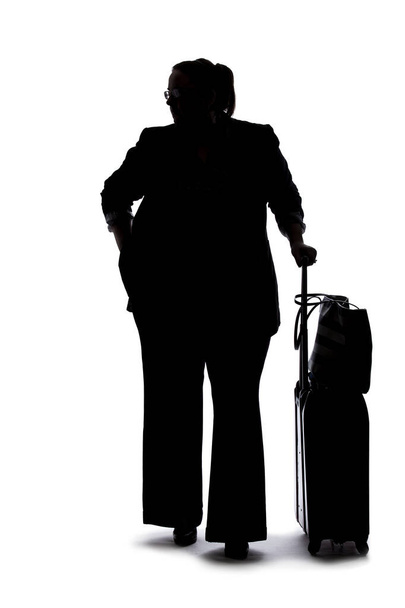 Silhouette of a curvy or plus size businesswoman on a white background for composites.  She is waiting patiently - Foto, imagen
