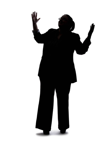 Silhouette of a curvy or plus size businesswoman on a white background for composites.  She is posed like she is angry - Foto, Imagen