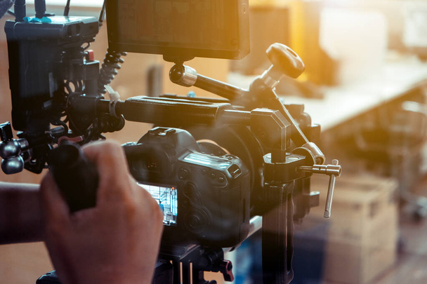 filming crew. cameraman shooting film scene with camera - Foto, afbeelding