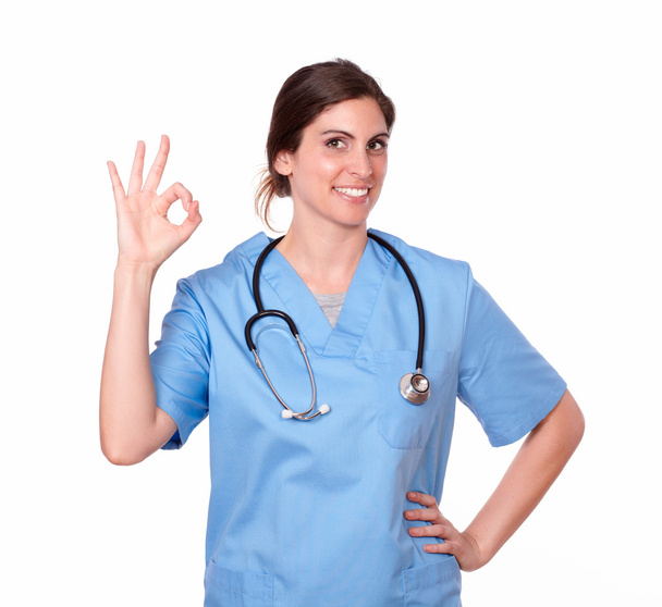 Hispanic lady nurse smiling with ok finger sign - Fotografie, Obrázek