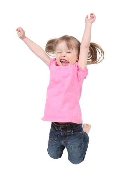 Adorable little girl jumping in air. isolated on - Foto, imagen