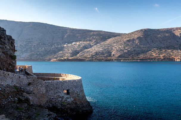 Spinalonga fortress on a clear sunny day. The ruins of leprosolium. - Photo, Image