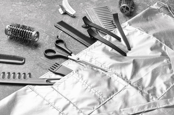 Set of hairdresser tools and accessories on grey background - Photo, Image