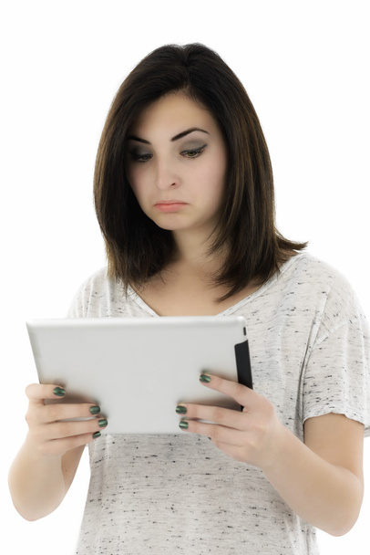 Joven estudiante sorprendida con la tableta de la PC
 - Foto, imagen