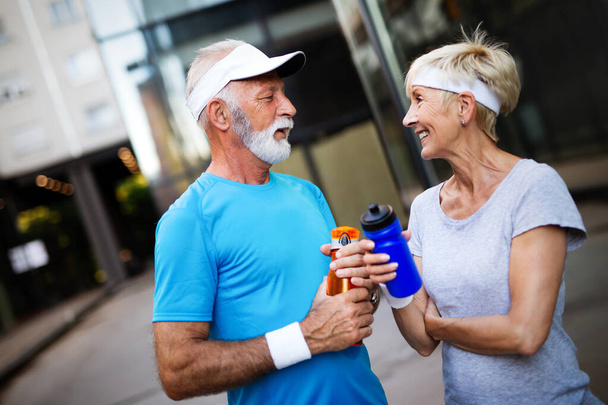 Active and sporty senior couple engaging in healthy sports activies - Zdjęcie, obraz