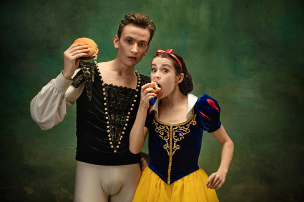 Young ballet dancers as a Snow Whites characters in forest modern tales - Foto, afbeelding