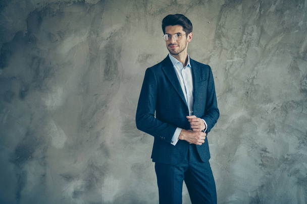 Photo of cheerful positive business man standing confidently in formalwear with stubble isolated grey color background - Photo, image