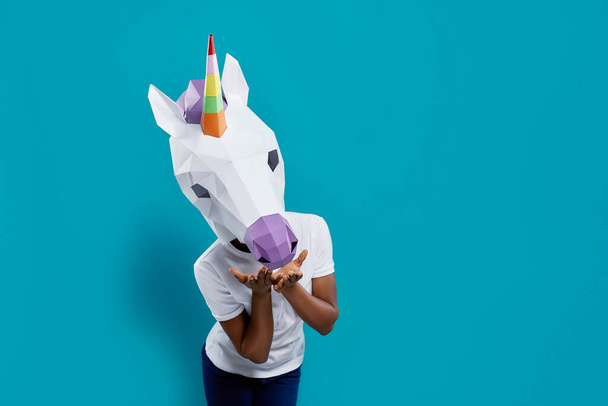 Female posing with colorful 3d papercraft in form of unicorn - Zdjęcie, obraz