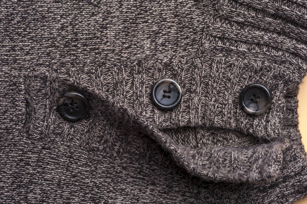 Close-up of a gray knitted warm jacket - Фото, зображення