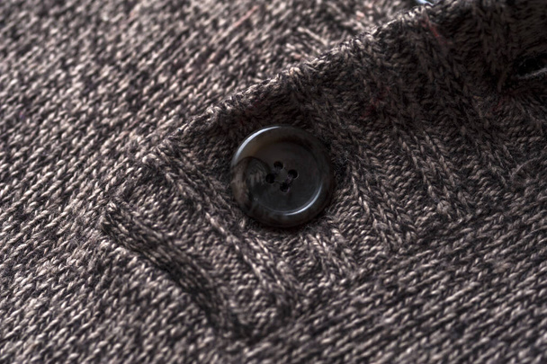 Close-up fragment of a gray knitted warm jacket - Fotoğraf, Görsel