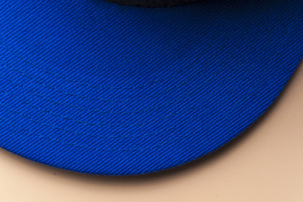 Fragment of the visor of a blue baseball cap - Foto, imagen
