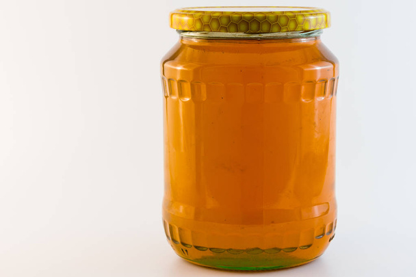 glass jar with honey isolated - Φωτογραφία, εικόνα