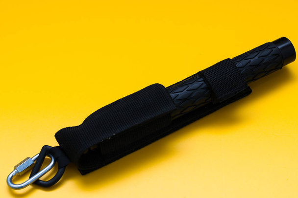 Black telescopic expandable baton / truncheon isolated - Photo, Image